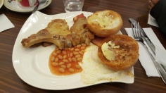 Eggs, bacon, "baked beans", pork chop and, uhh, bread with sweetened condensed milk. Interesting.